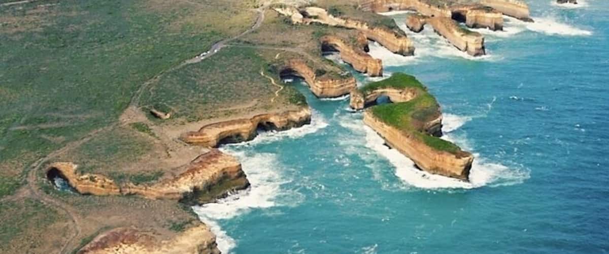 Book a helicopter flight along the Great Ocean Road for an unforgettable view. Roadside outlooks will get you in the mood, but the only way to fully appreciate the scenery is to get airborne.
The Great Ocean Road is a 151mi (243km) road that winds it's way along a particularly beautiful stretch of Australia's south-eastern coast. It was built during the 1920s by returning soldiers and is the world's largest war memorial. The towns along the coast are charming, so book a couple of nights and get out of the city. Makes for a great road trip from Melbourne to Adelaide.