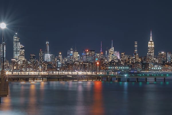 Midtown Manhattan as seen from the New Jerseyâs J. Owen Grundy Park. This beautiful skyline showcases the Empire State Building and the Chrysler Building among one of the most prominent and historical architectural structures of the city.