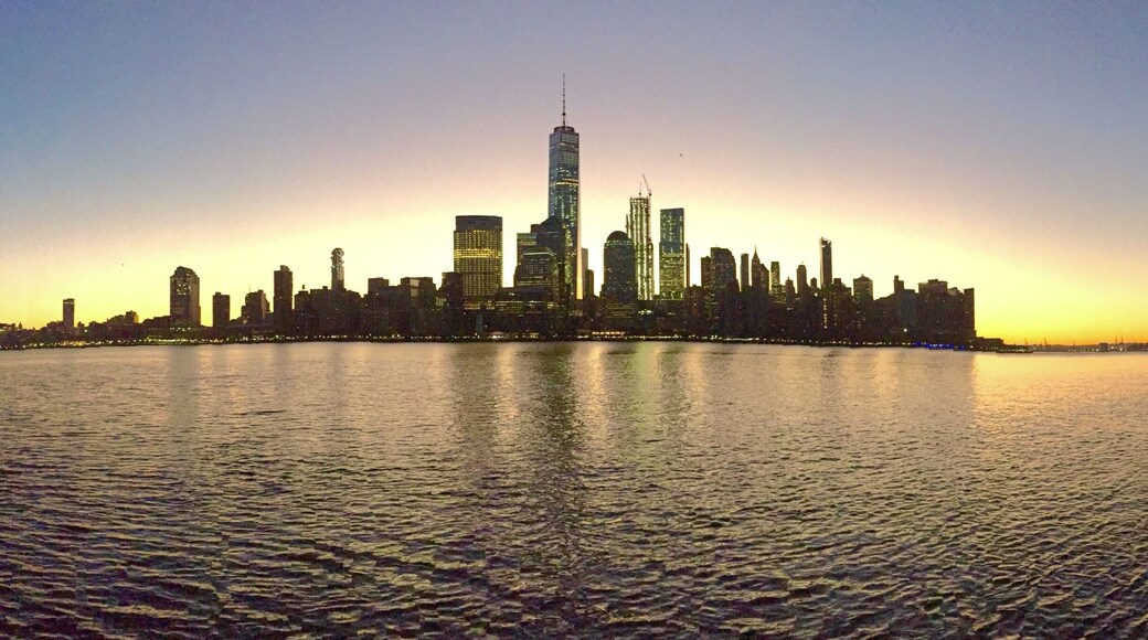 This the view of New York City at dawn from Jersey City. The best place I reckon to take a photo of the New York City skyline (from Jersey side) is from the Hudson River Waterfront Walkway.