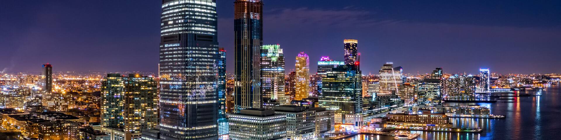 Aerial panorama of Jersey City skyline at night