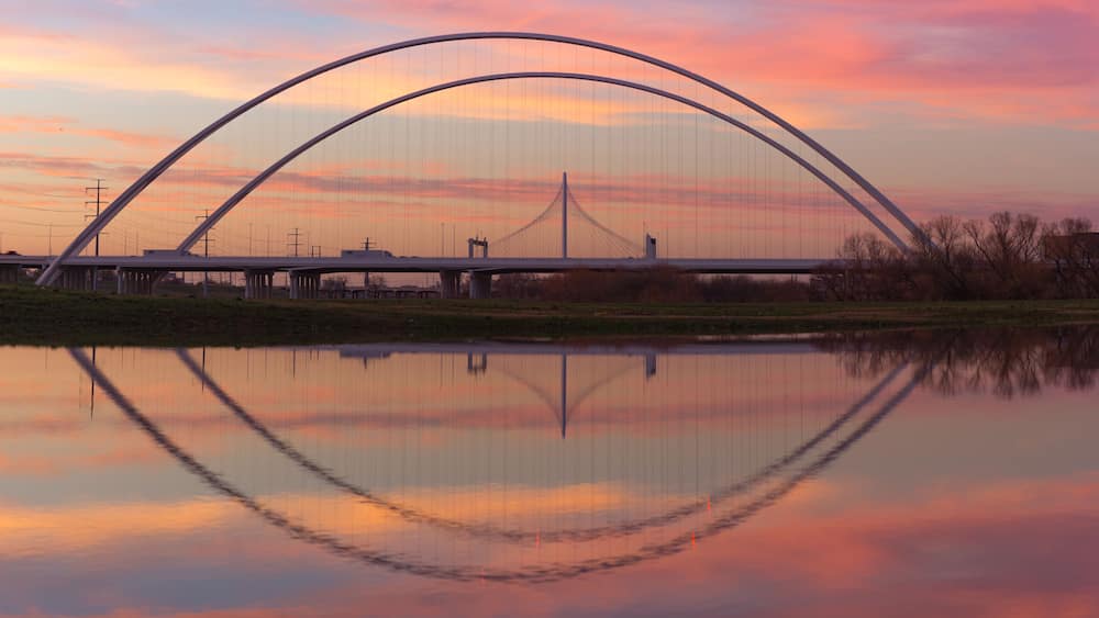 Reflection of Margaret Hunt Hill Bridge and Margaret McDermott Bridge during Sunset from Trinity River, Dallas, Texas