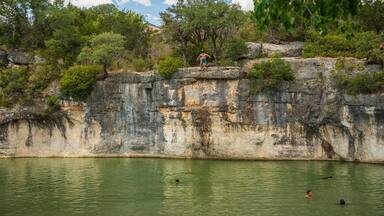 Georgetown which includes a lake or waterhole and swimming