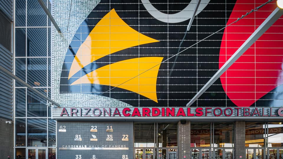 The Arizona Cardinals Football stadium with a large logo and seating area.