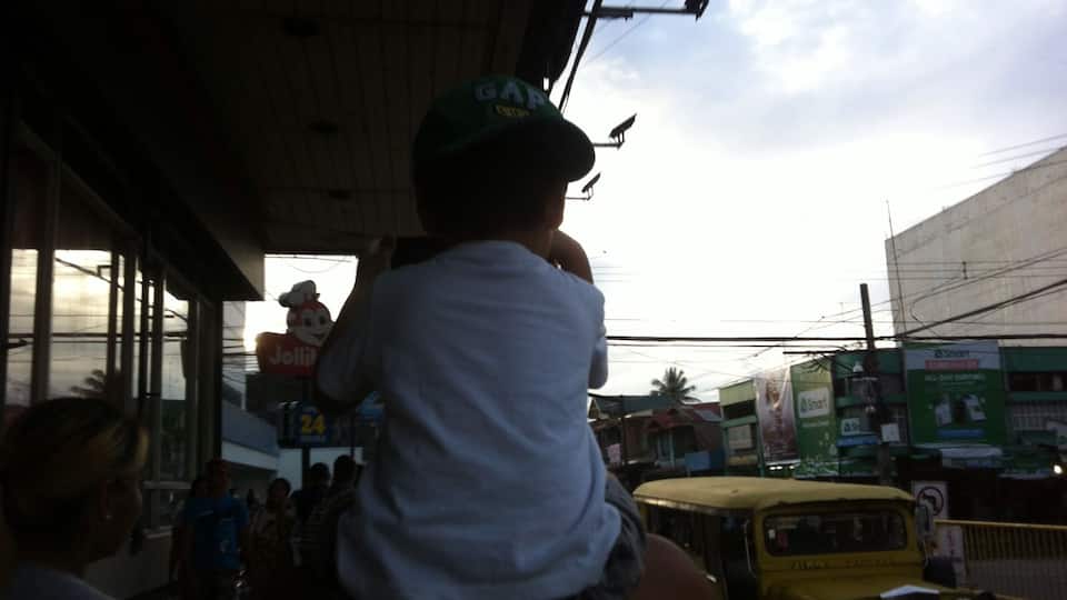 This was a quick shot on my way back to the hotel we were staying at. The picture was a bit dark but I just wanted to share that while a poor family was walking infront of me with their back turned, they were laughing so hard that although I cannot understand what they've been saying, they look so happy and contented.