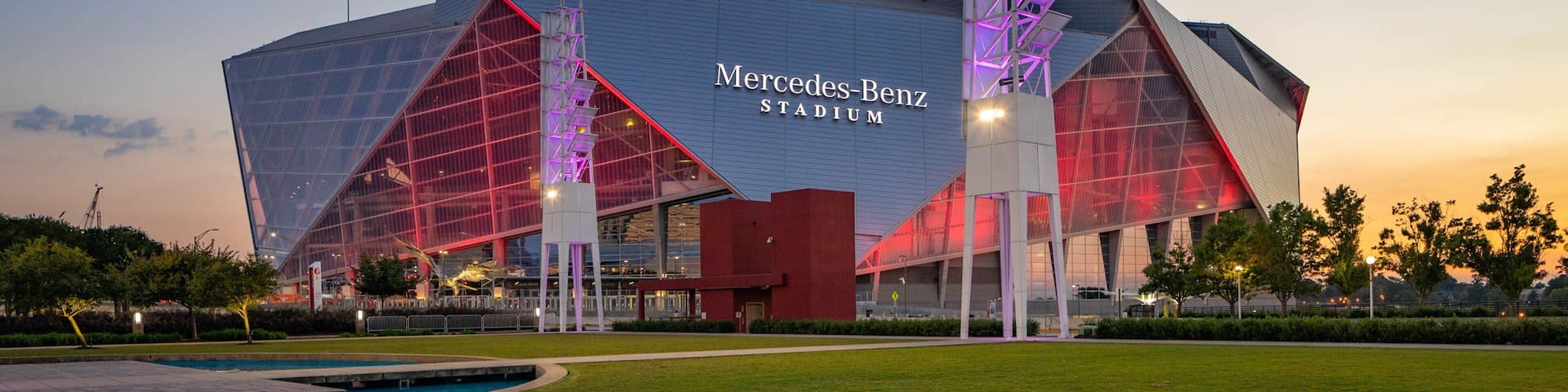 The Mercedes-Benz Stadium with its distinctive modern architecture and illuminated structure.