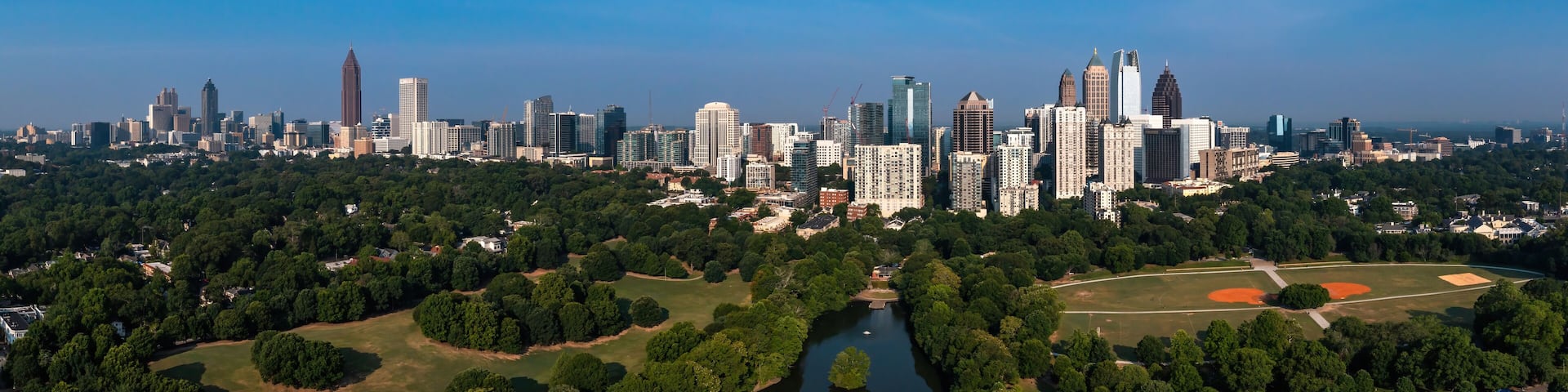 A city skyline with a river and park areas.
