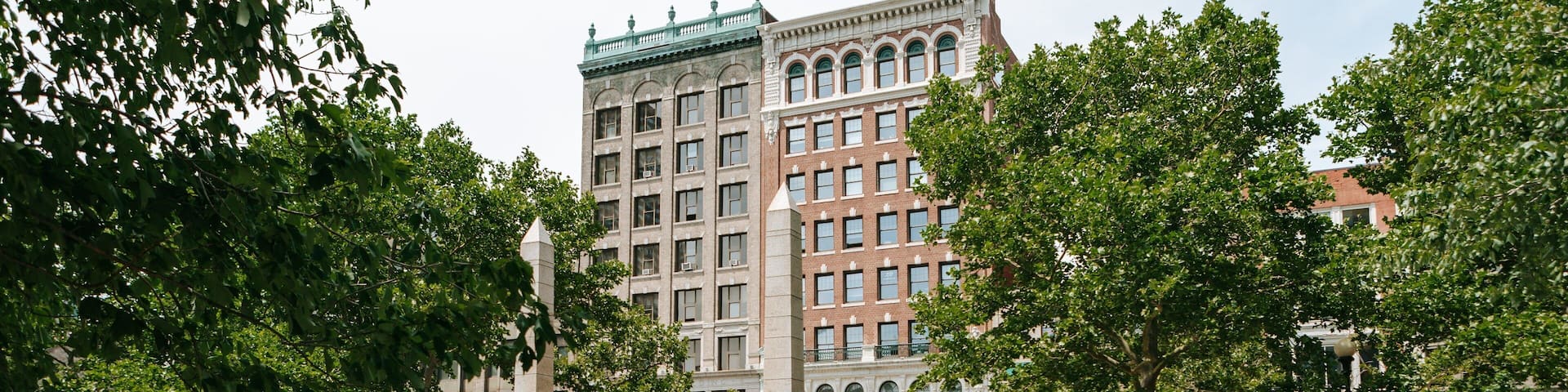 Back Bay which includes a fountain and a river or creek as well as a small group of people