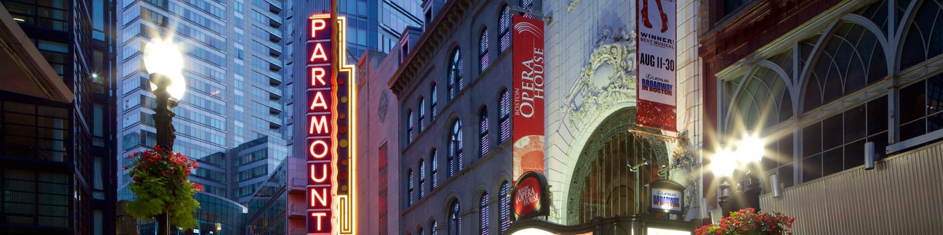 Theatre District featuring signage, a city and central business district