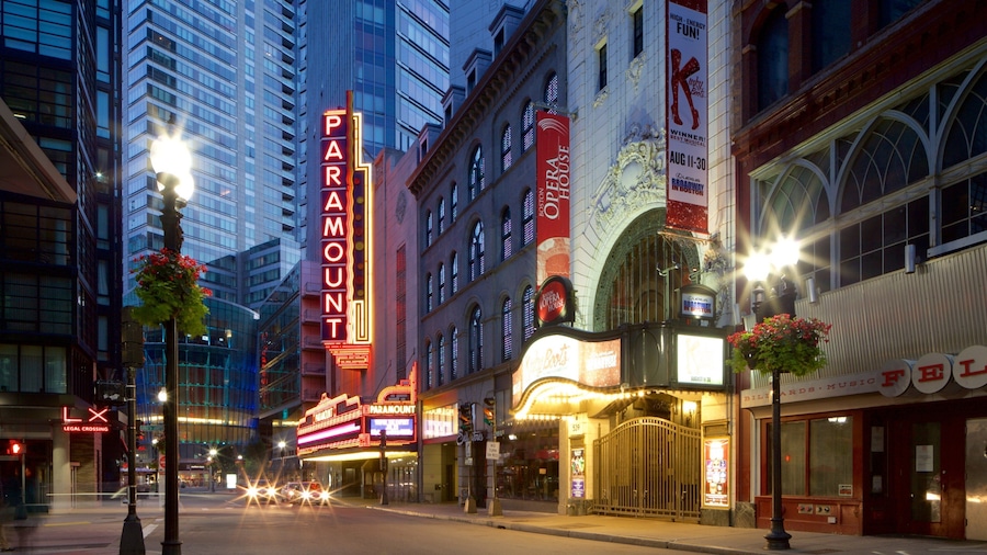 Theatre District featuring signage, a city and central business district