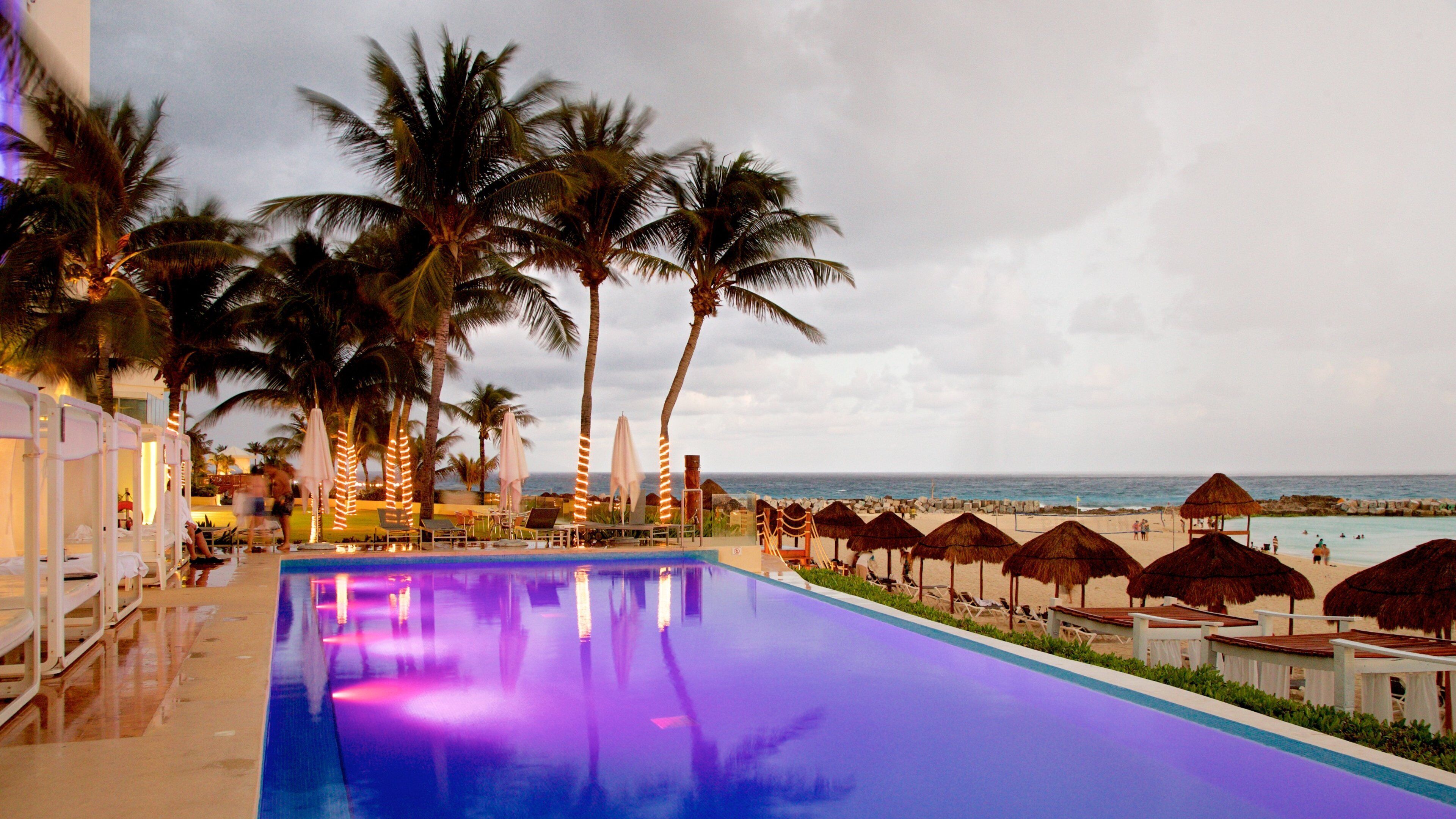 Hotel Zone showing tropical scenes, a pool and general coastal views