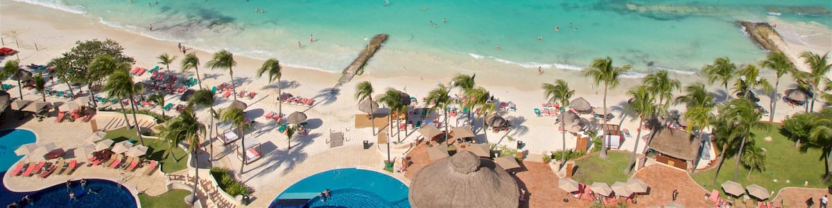 Hotel Zone showing a sandy beach, tropical scenes and general coastal views