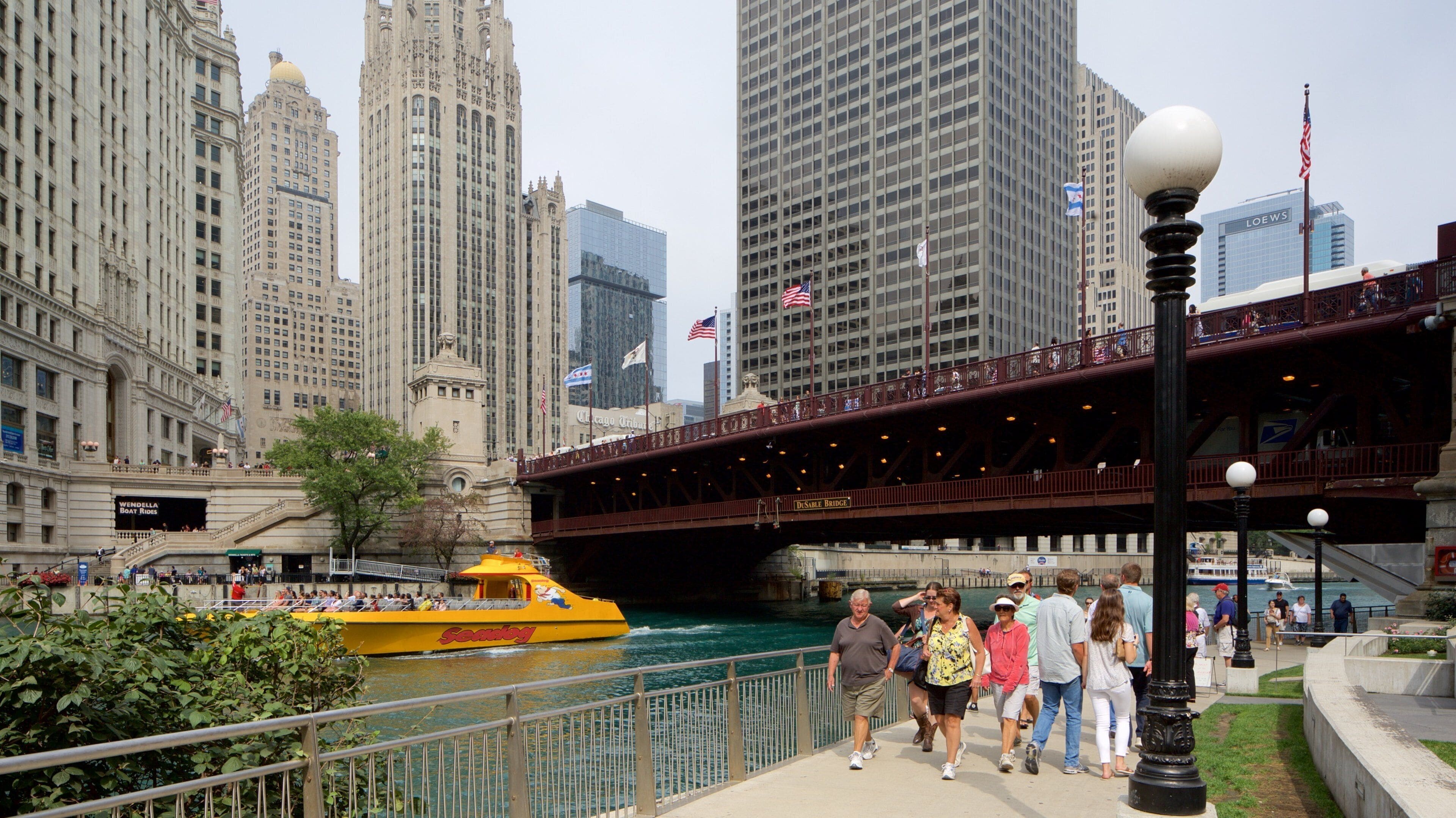 The Loop which includes hiking or walking and a river or creek as well as a large group of people