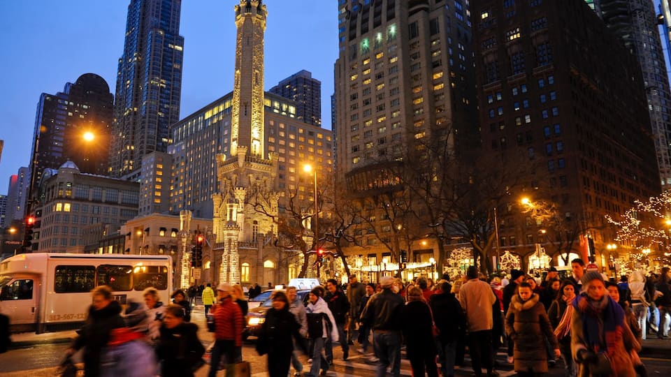 Magnificent Mile - River North which includes night scenes, a high rise building and a city