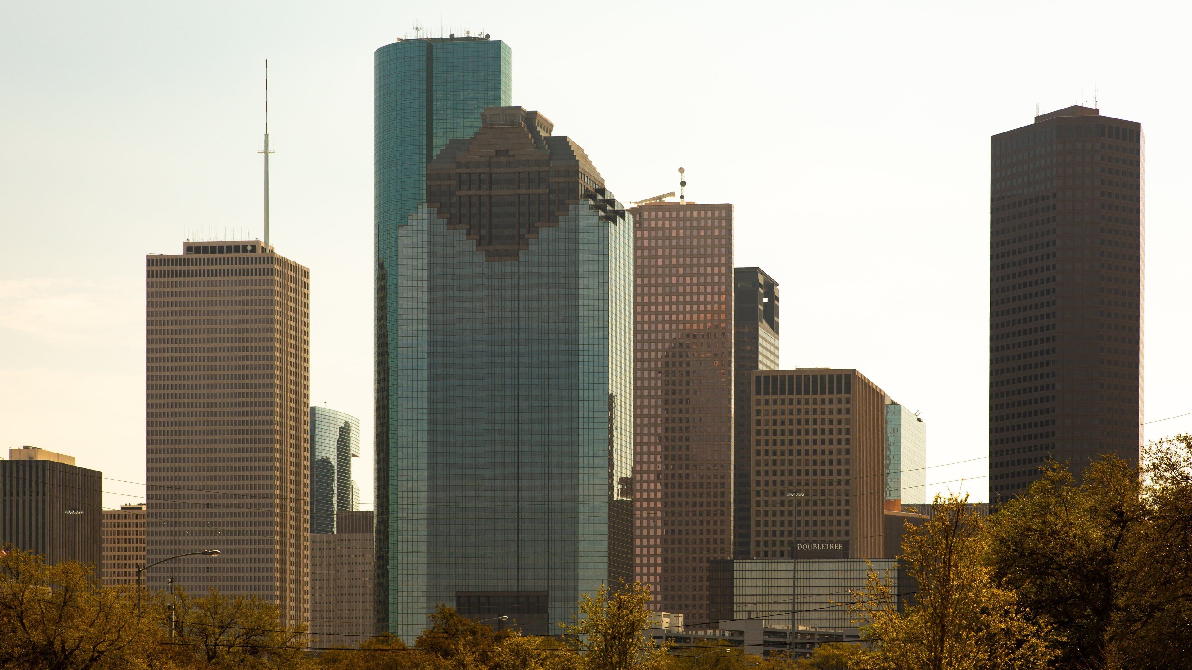Downtown Houston featuring a skyscraper, a city and a sunset