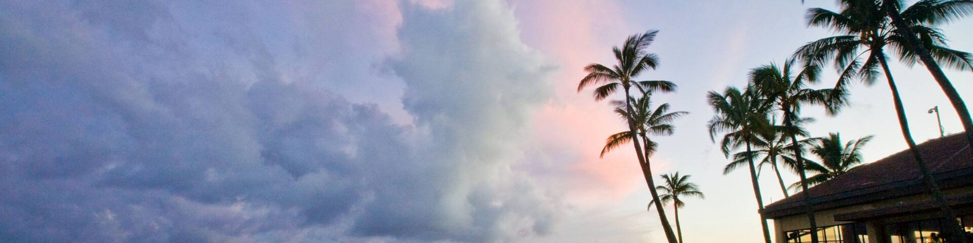 Poipu featuring tropical scenes, general coastal views and a sunset