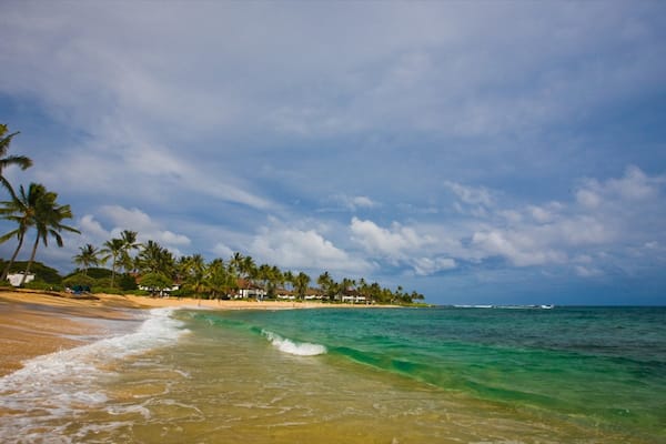 Poipu showing a beach, tropical scenes and landscape views