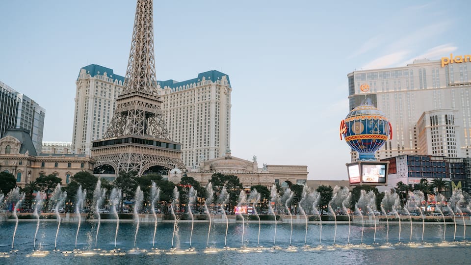 Las Vegas Strip showing a monument, a fountain and a city