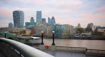The City of London which includes a skyscraper, heritage architecture and a sunset