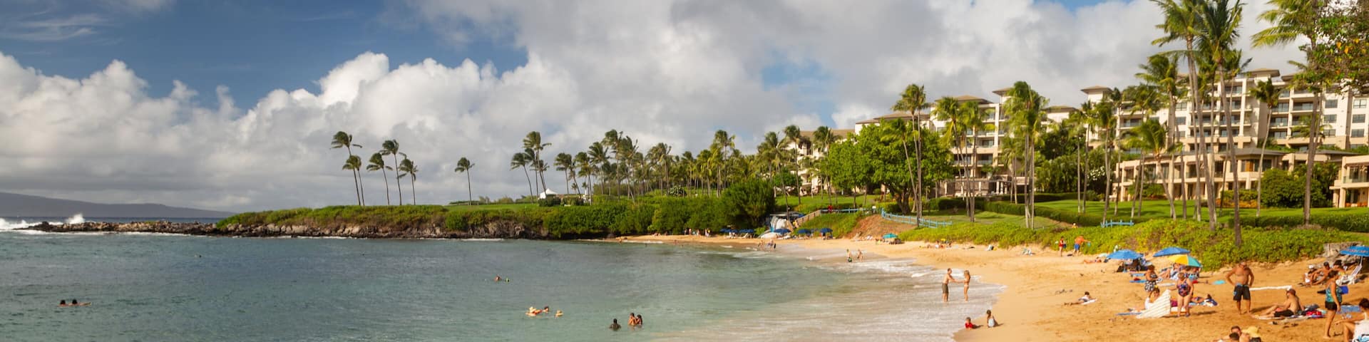 Kapalua showing a beach, a coastal town and general coastal views