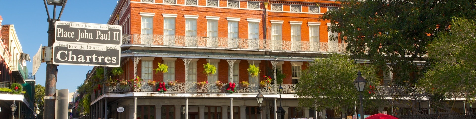 Vibrant atmosphere in the French Quarter showcasing culture and community on a sunny day