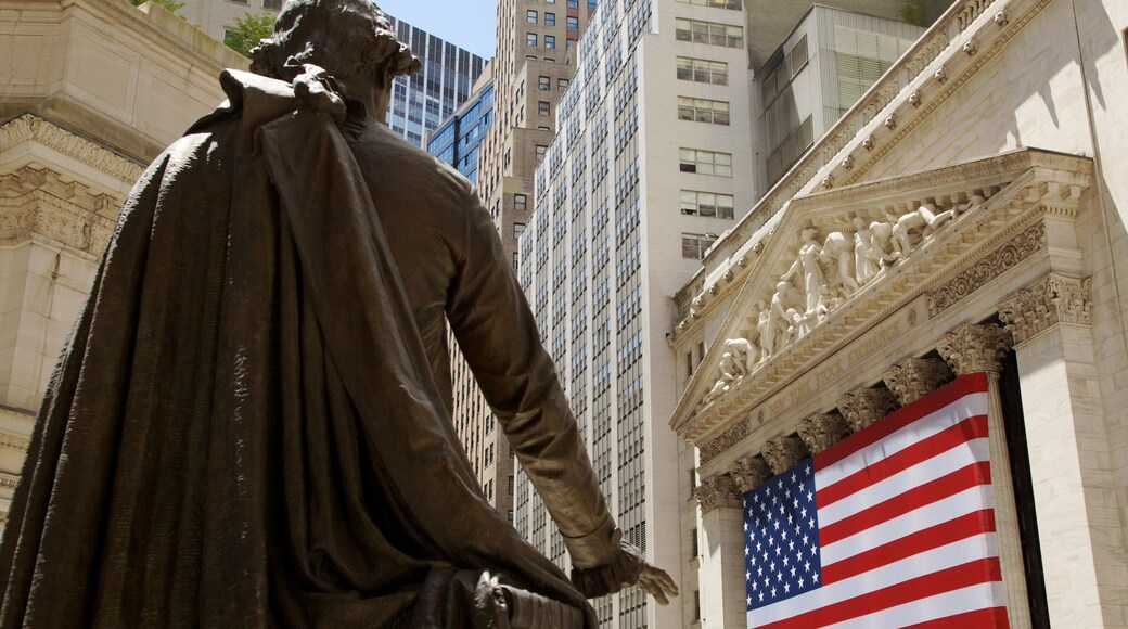 Wall Street - Financial District showing a city, central business district and a statue or sculpture