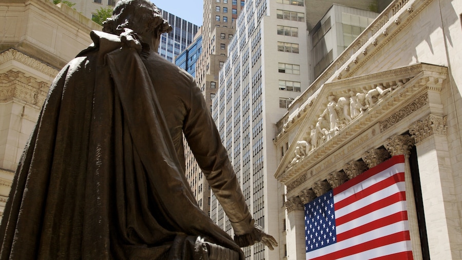 Wall Street - Financial District showing a city, central business district and a statue or sculpture
