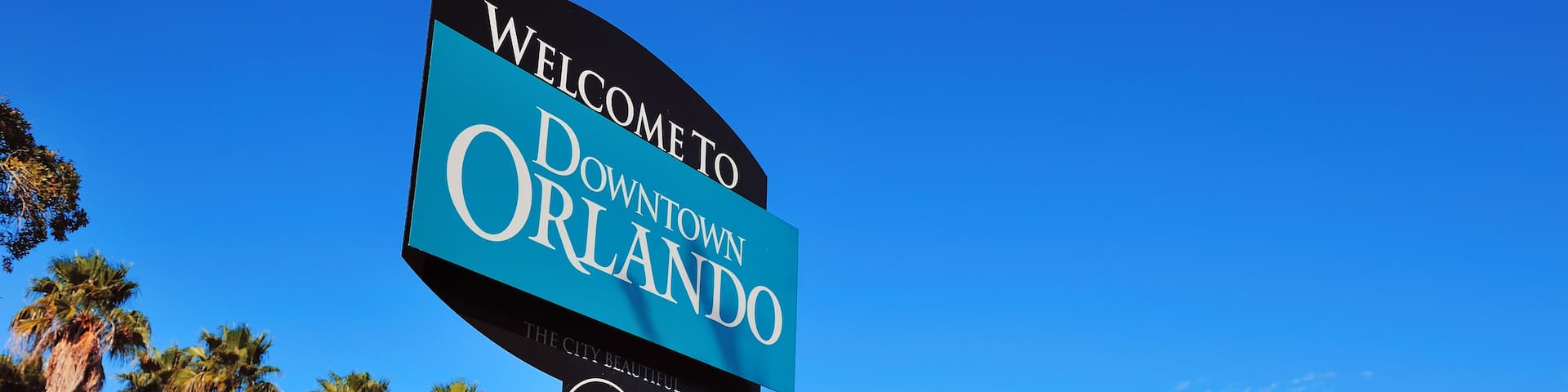 Orlando downtown welcome sign with tropical scene; Shutterstock ID 99801884