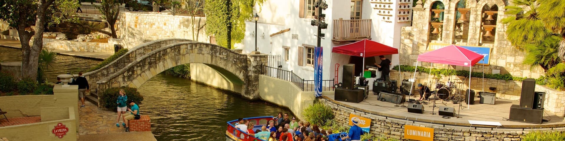 Downtown - Riverwalk showing a river or creek, a bridge and boating