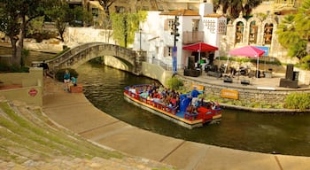 San Antonio River Walk showing a river or creek, a bridge and heritage architecture