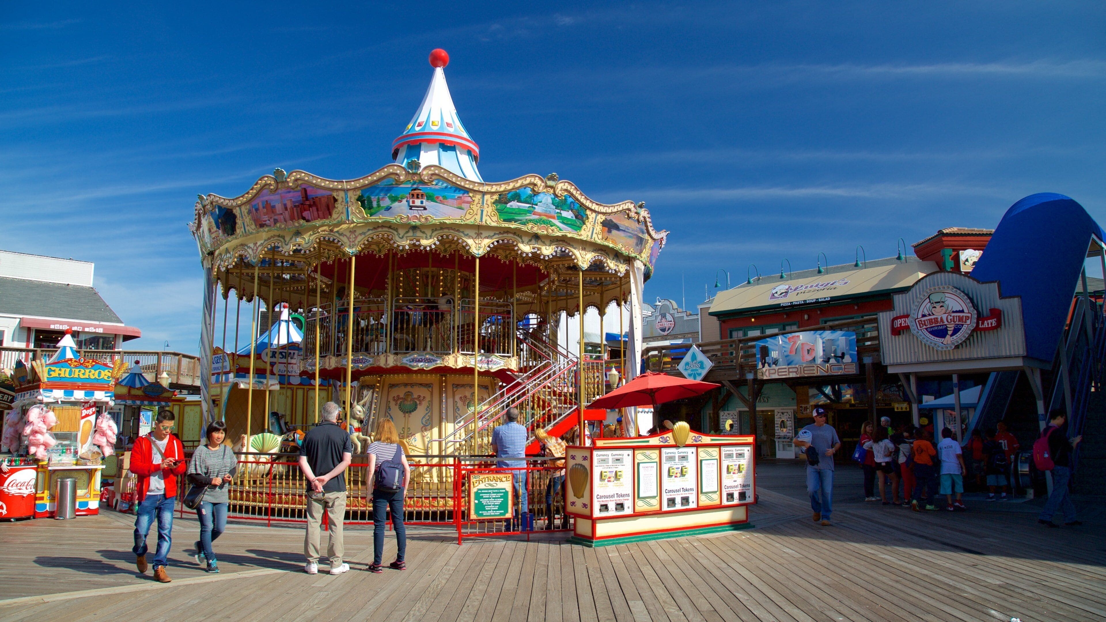 Fisherman\'s Wharf showing rides and street scenes as well as a small group of people