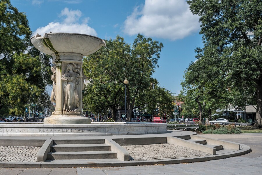 Dupont Circle Fountain surrounded by greenery and visitors in Washington, D.C.