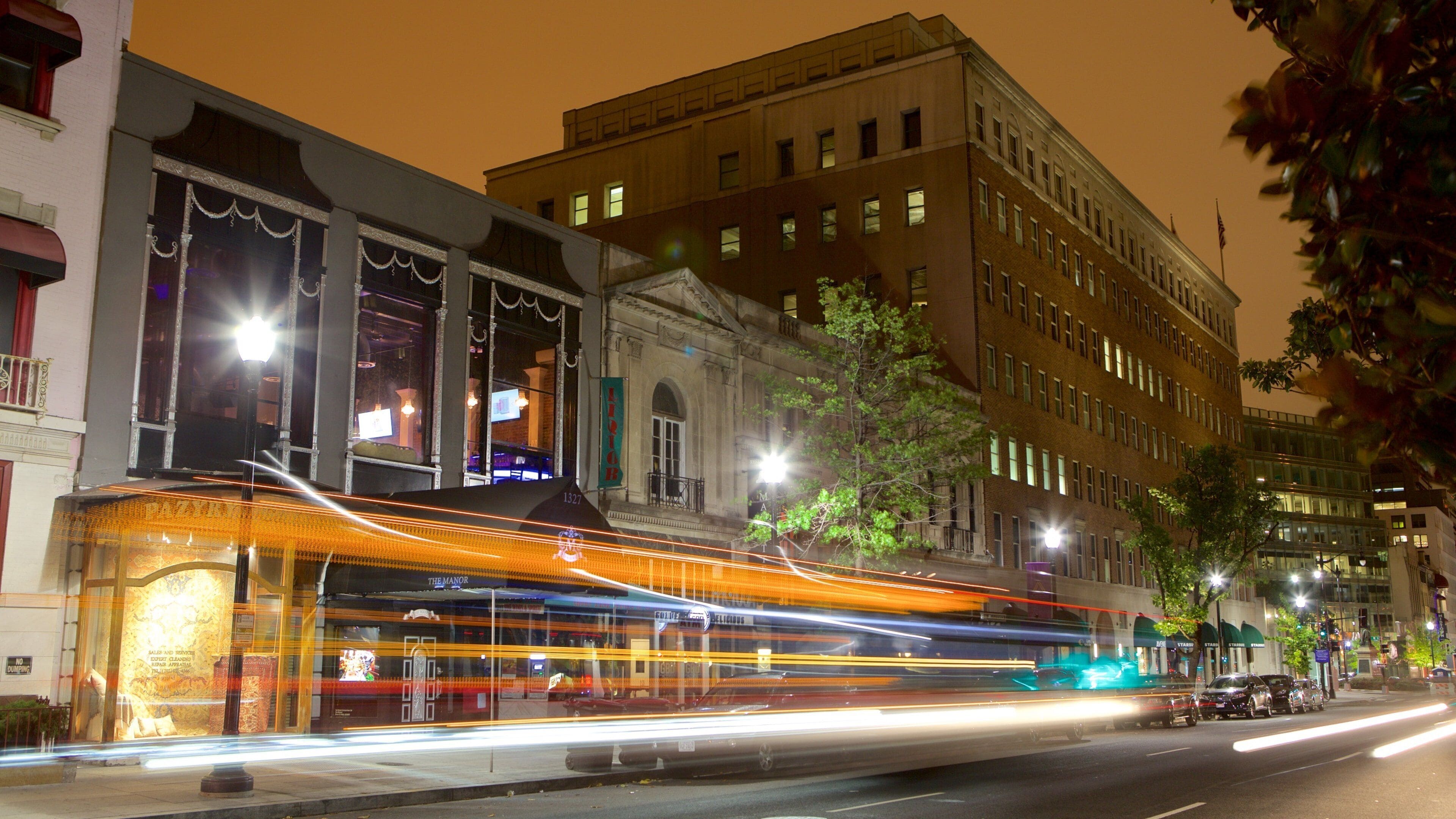 Downtown Washington D.C. which includes night scenes, street scenes and a city