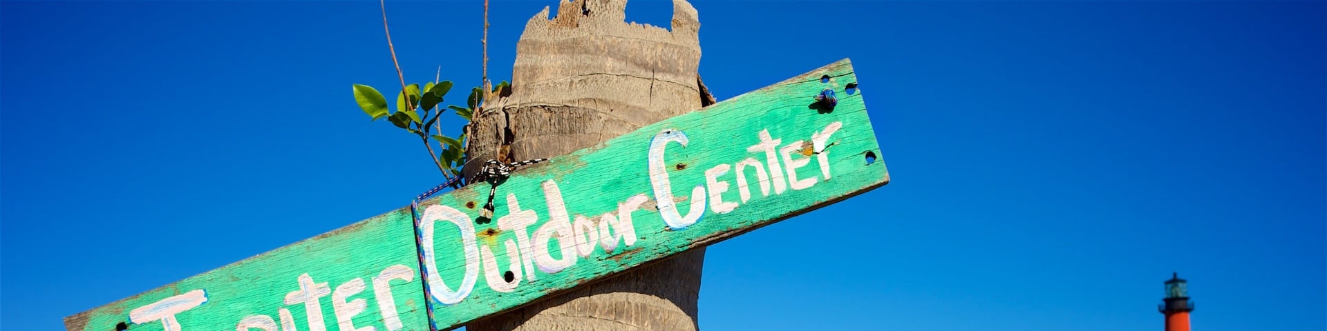 Jupiter featuring signage and a bay or harbour