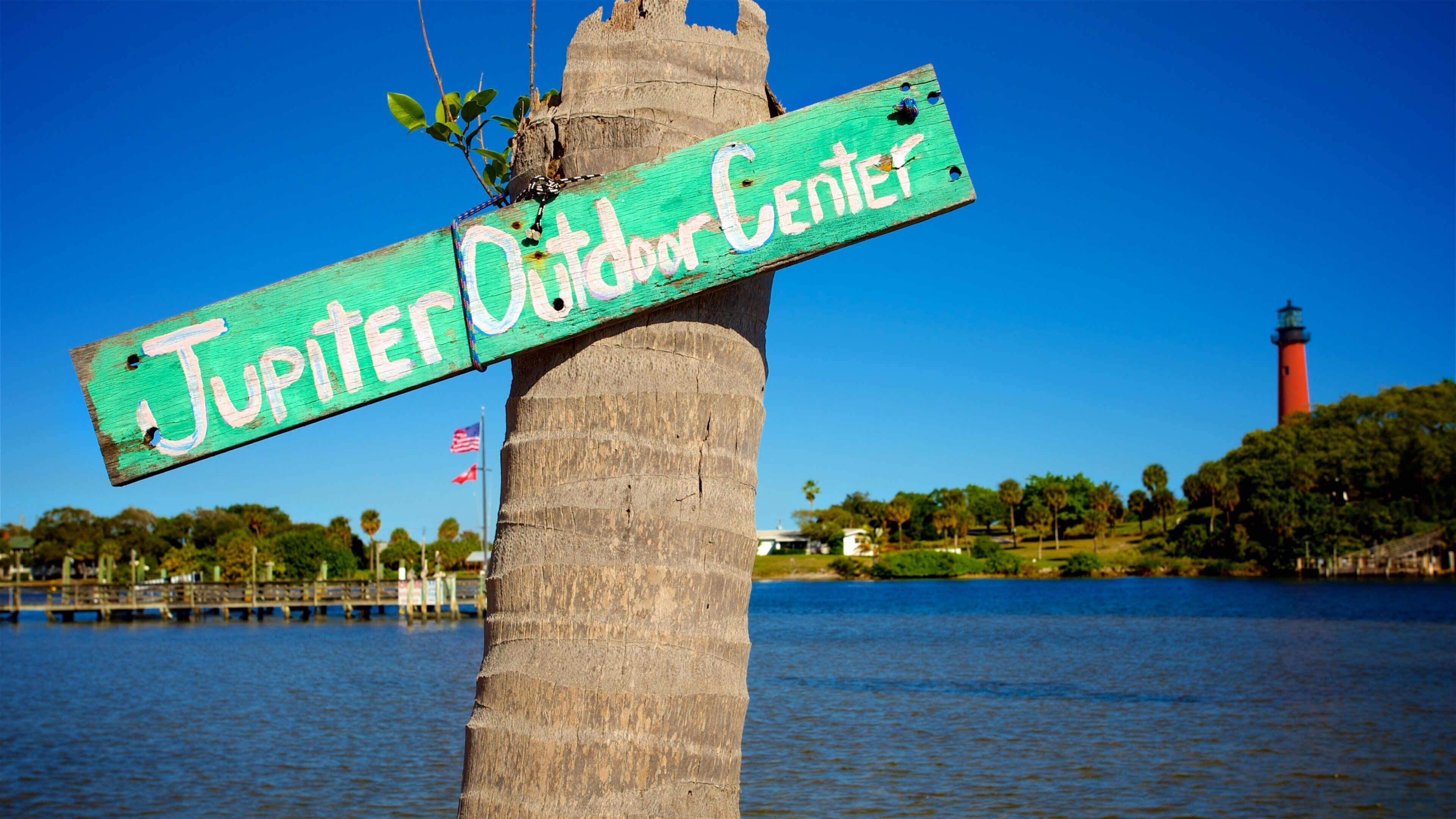 Jupiter which includes a bay or harbour and signage