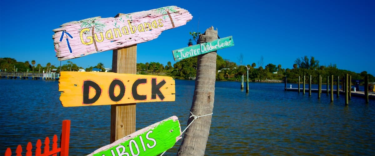 Jupiter showing signage and a bay or harbor