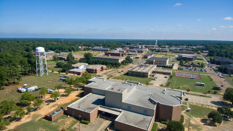 aerial shot of a gorgeous autumn landscape at Grambling State University with red brick buildings across the campus, water towers and lush green trees and grass in Grambling Louisiana USA