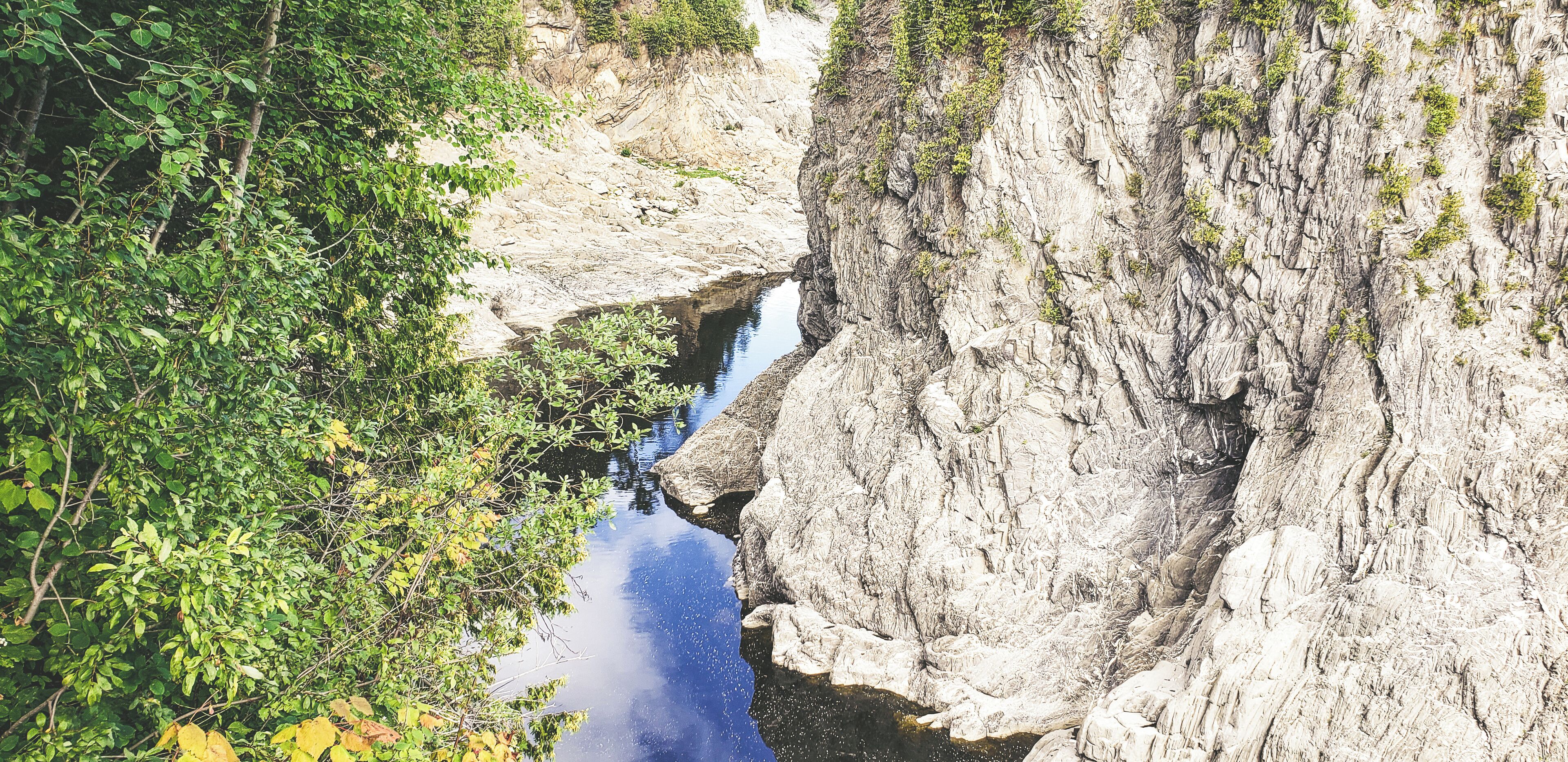 The Falls & Gorge walk is approximately 5 KM depending where you start. Along the path you can find geocaching, a nice picnic area, and a place that you can pay a small fee to take over 200+ stairs to different sections of the gorge below. Depending on whether you take photos or walk right through I easily spent 3 hours here. The paths are not wheelchair friendly in many areas, but there are sections where you can drive up to and look down. What I like most about this photo is that if you look closely you can see a man's face about to be submerged in water. 