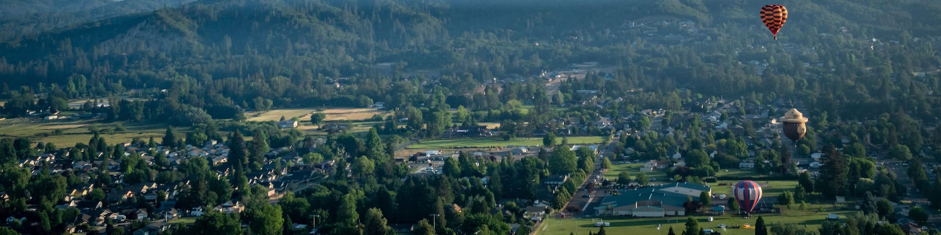 Colorful hot air balloons over Grants Pass Oregon on a beautiful summer morning