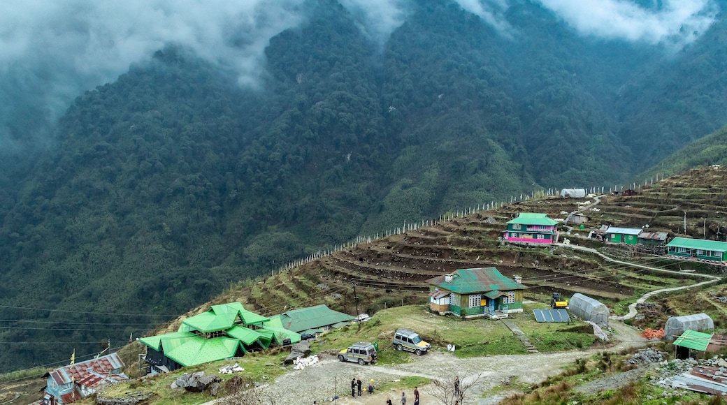 A hilltop View of beautiful misty mountain range with zuluk village.