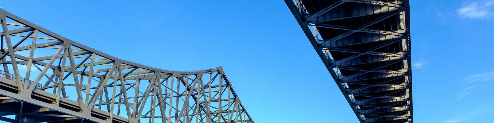 view of the Crescent City Connection, formerly the Greater New Orleans Bridge. It comprises twin cantilever bridges that carry U.S. Route 90 Business over Mississippi River in New Orleans, Louisiana