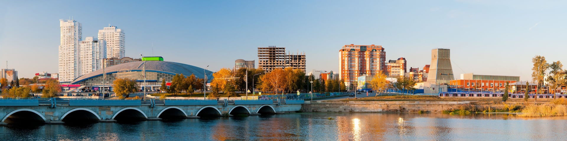 Panorama of the autumn embankment of the river Miass