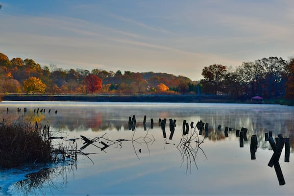 The last of the fall colors, with one lone, bright red tree at my local county park. Taken early in the morning while the steam was still rising on the water. #Red #Colorful #Reflections