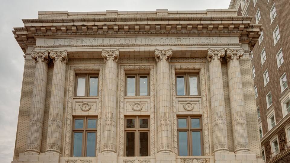 A building with columns and a sign that reads "Greenview County Courthouse."