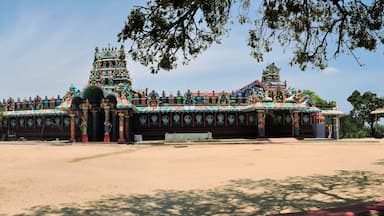 A large, ornate temple with multiple spires and colorful decorations.