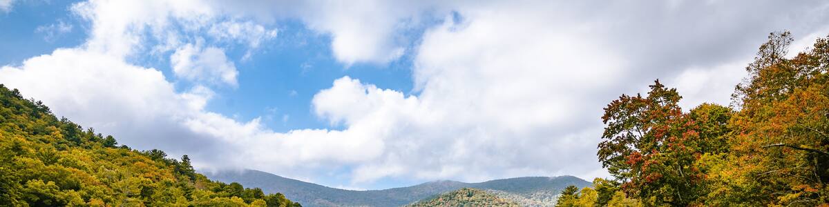 wide open landscape with lake and mountains and cloud with sky reflecting in water at vogel state park in Georgia
