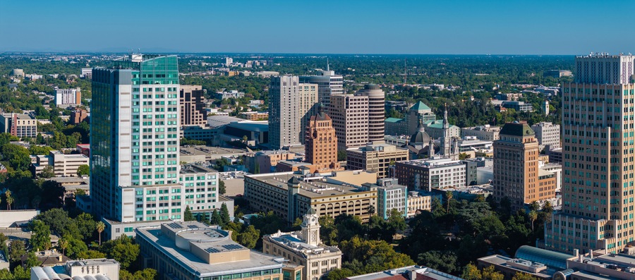 The Tower Bridge in Sacramento, California with the city of of Sacramento in the background and blue sky