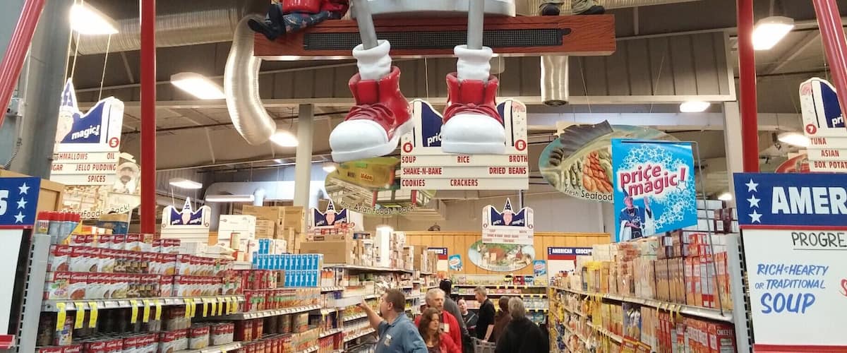 An enormous anthropomorphic can of Campbell's Soup flanked by the Campbell's Kids on a giant playground swings looms overhead. M'm! M'm! Weird! 
Just one of many, many oddities that greet visitors/shoppers of Jungle Jim’s International Market, a 200,000 square feet destination grocery store!