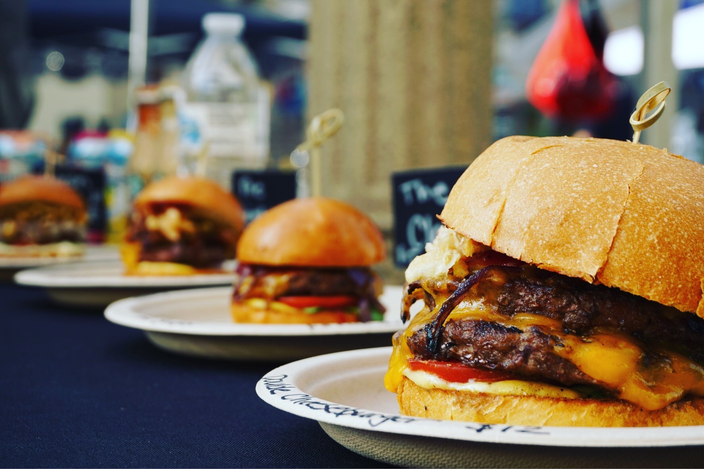 A row of hamburgers at #eventrockit so good 