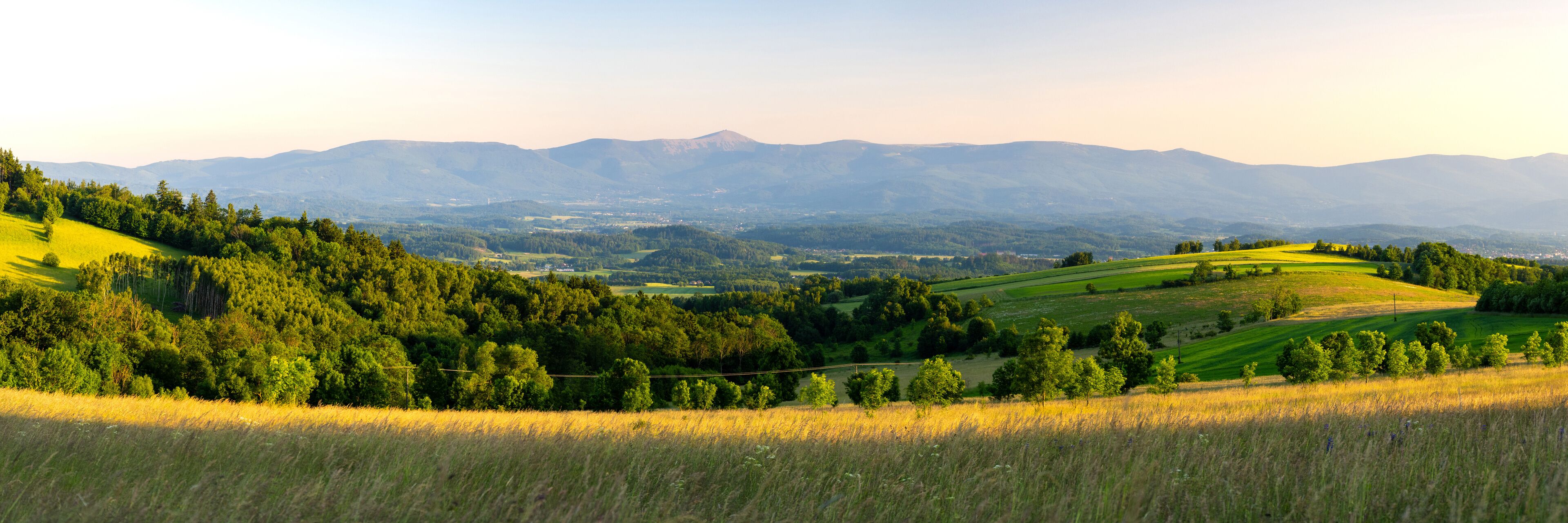 panoramic view on Karkonosze mountains during summer sunset