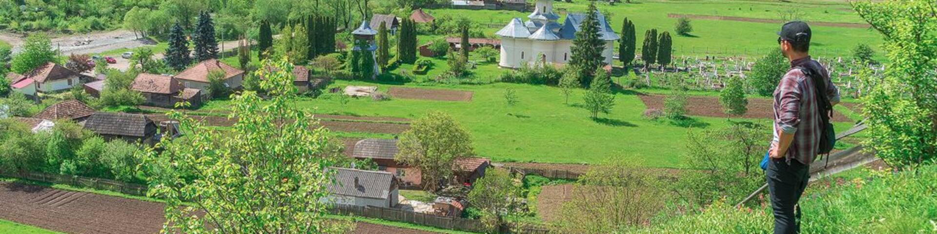 Ghimes (Fage) is a Hungarian town that used to be the border of the Austo-Hungarian empire. Here I'm literally straddling the border overlooking a Romanian village.
http://www.alwayswanderlust.com/straddling-the-border-of-the-austro-hungarian-empire/